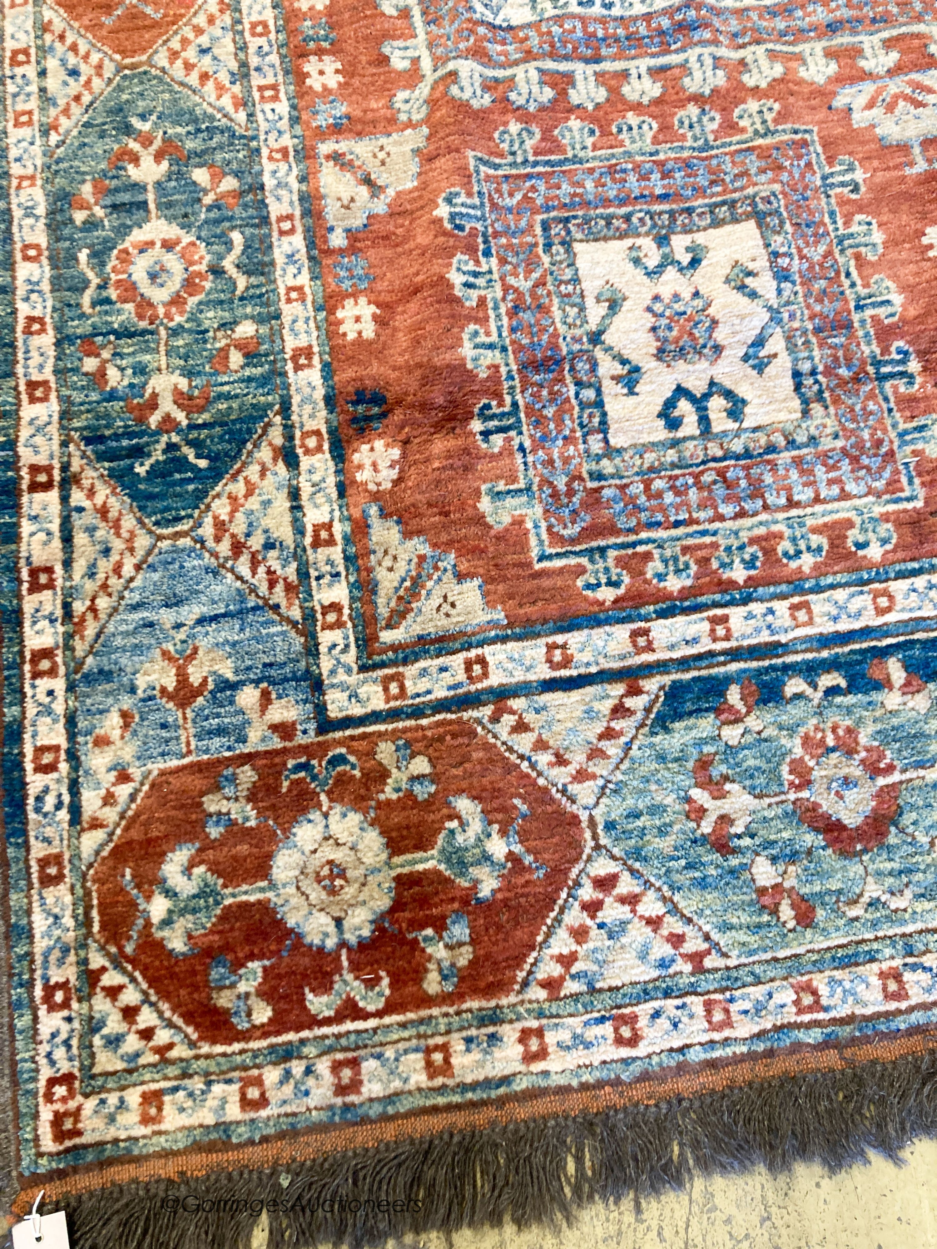 A Caucasian design carpet, 240 x 170cm